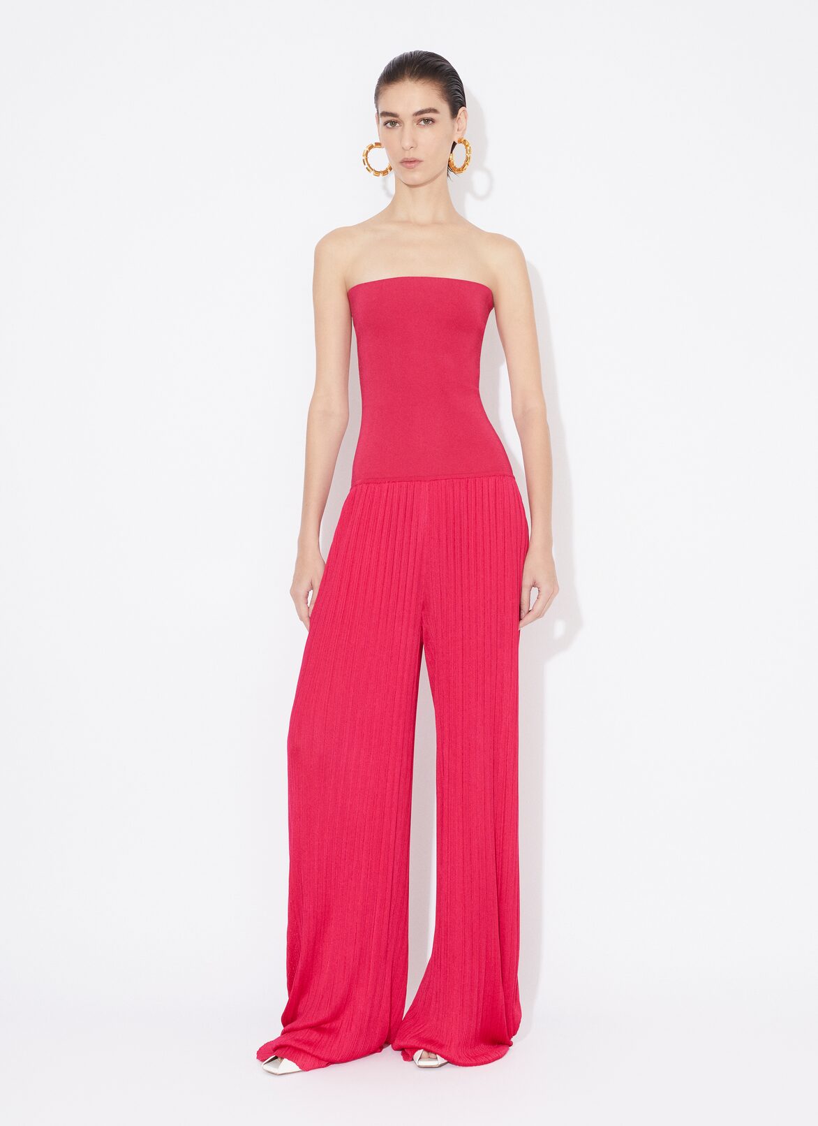 BUSTIER JUMPSUIT IN PLEATED KNIT ALAÏA PINK BUSTIER JUMPSUIT IN PLEATED KNIT